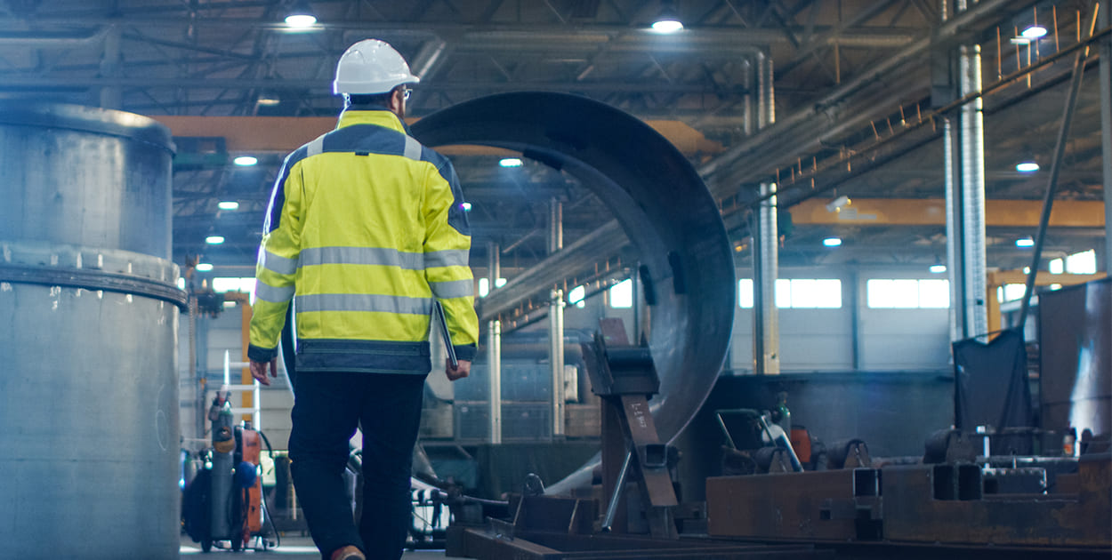 Stock image showing worker in metal industry
